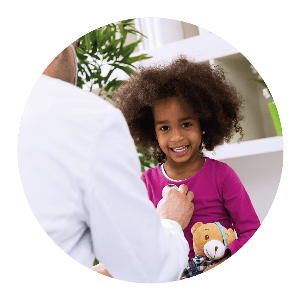 Image of a young girl smiling whilst at a doctors surgery